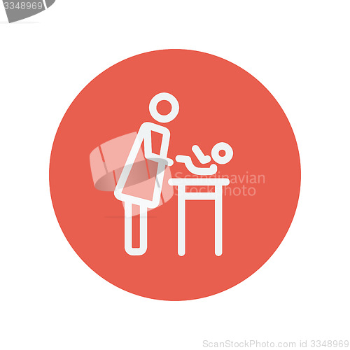 Image of Woman changing the diaper thin line icon