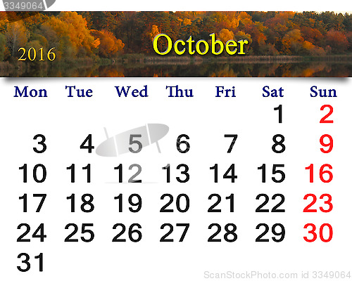 Image of calendar for October 2016 and forest lake with trees