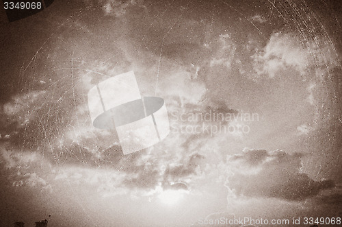 Image of Vintage sky background with dark border and retro texture.
