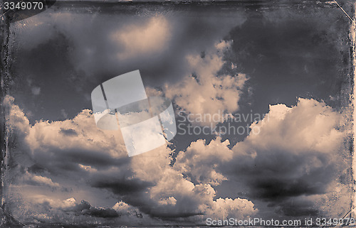 Image of Vintage sky background with dark border and retro texture.