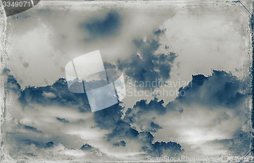 Image of Vintage sky background with dark border and retro texture.
