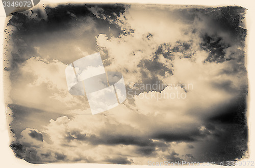 Image of Vintage sky background with dark border and retro texture.