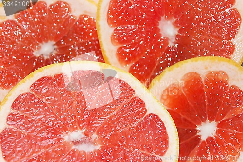 Image of grapefruit red cut by pieces