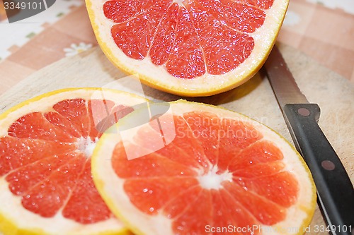 Image of grapefruit red cut by pieces