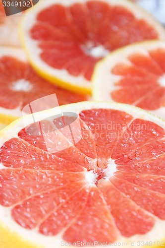 Image of grapefruit red cut by pieces