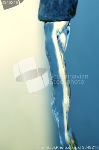 Image of Tap of running water isolated on grey background