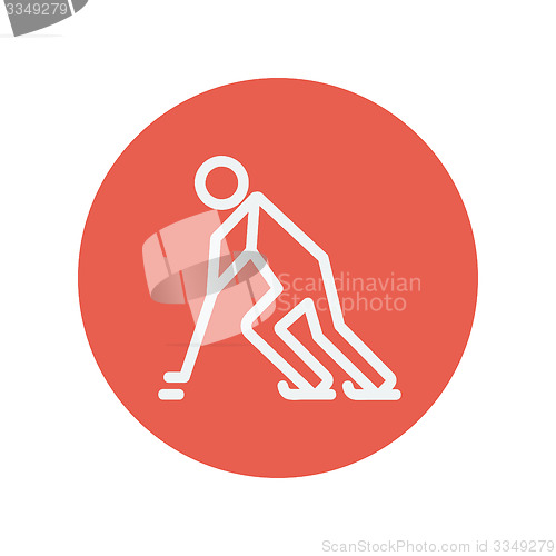 Image of Hockey player pushing the puck thin line icon