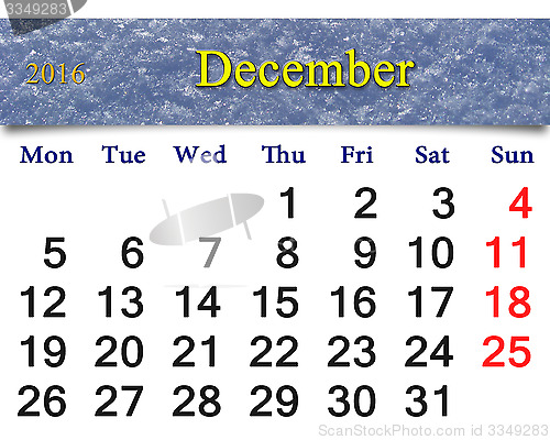 Image of calendar for December 2016 with layer of snow