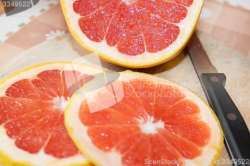 Image of grapefruit red cut by pieces