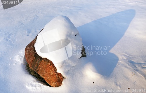 Image of stone under snow  