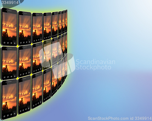 Image of black smart-phones with images of sunset in rows