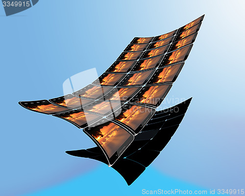 Image of black smart-phones with sunset like blanket