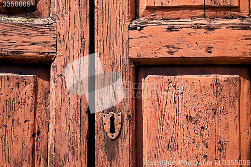 Image of door in italy old ancian wood and trasditional  texture nail