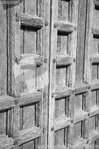 Image of door    in italy old ancian wood and traditional  texture nail