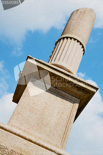 Image of old column in the cloudy sky of europe italy