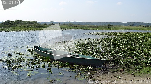 Image of wooden boat on the river