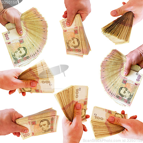 Image of hands offering Ukrainian money isolated