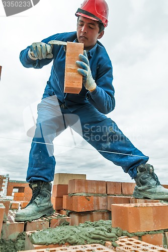 Image of Bricklayer on house construction