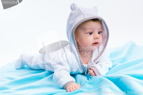 Image of baby on blue blanket