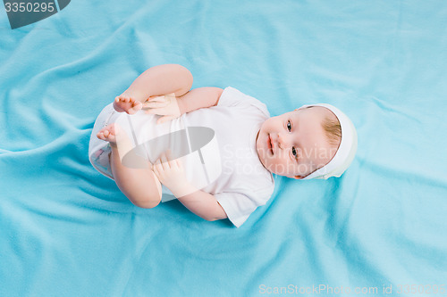 Image of baby on blue blanket