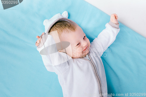 Image of baby on blue blanket