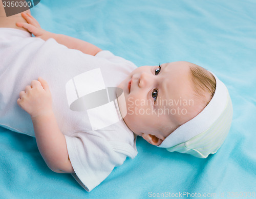 Image of baby on blue blanket