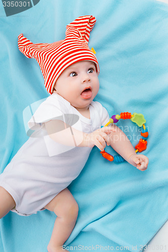 Image of baby on blue blanket