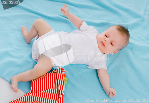 Image of baby on blue blanket