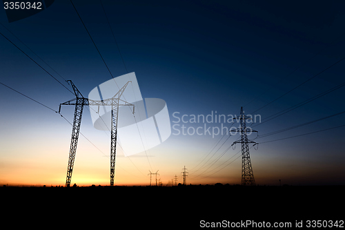 Image of Large transmission towers at blue hour 