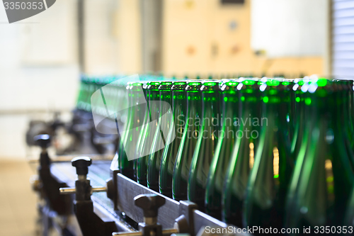 Image of Many bottles on conveyor belt