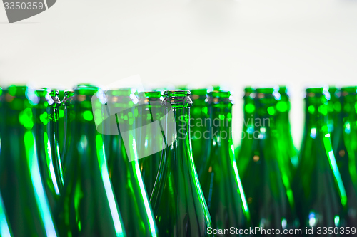 Image of Many bottles on conveyor belt