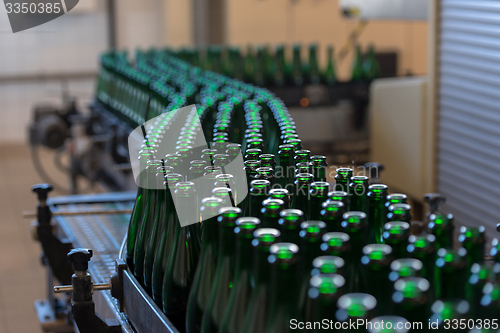 Image of Many bottles on conveyor belt