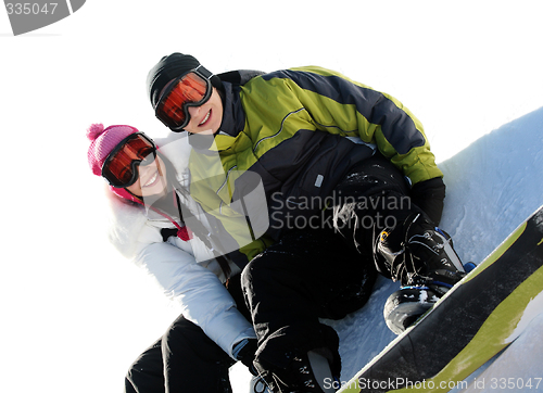 Image of Couple of happy snowboarders