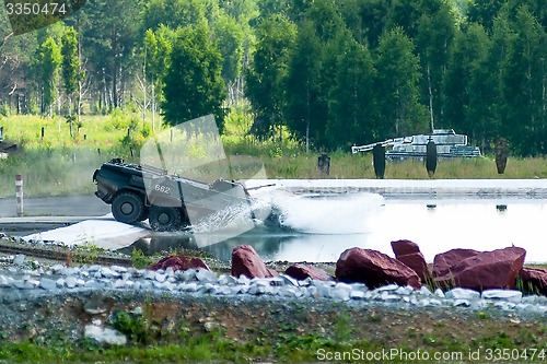 Image of BTR-82A armoured personnel carrier in water