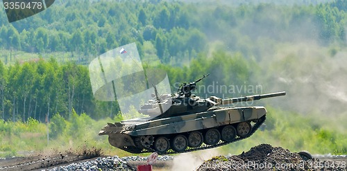 Image of Shooting tank T-80 jumps through ditch