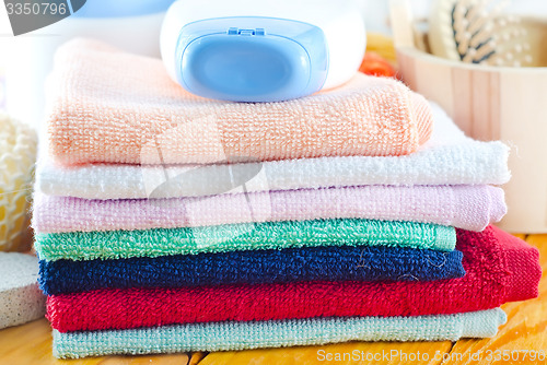 Image of shampoo, body wash and towels