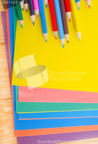 Image of color paper and pencils