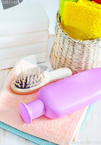 Image of color towels and shampoo