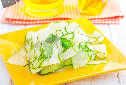 Image of Fresh salad with fresh cucumber and parsley