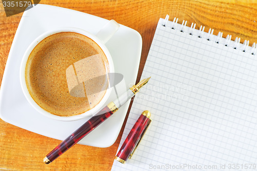 Image of coffee and note