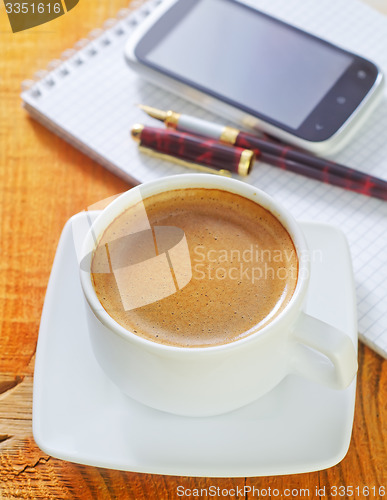 Image of coffee and note