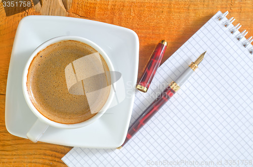 Image of coffee and note