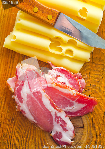 Image of Bacon with cheese on the wooden board