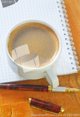 Image of coffee and note