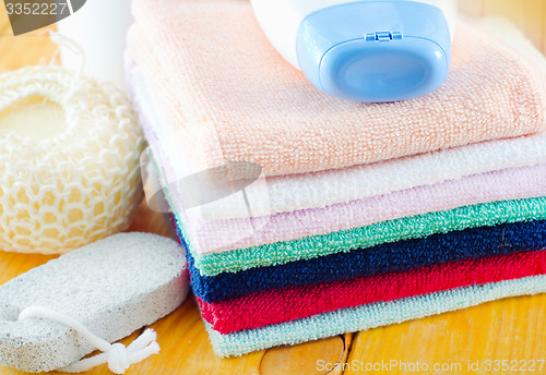 Image of shampoo, body wash and towels