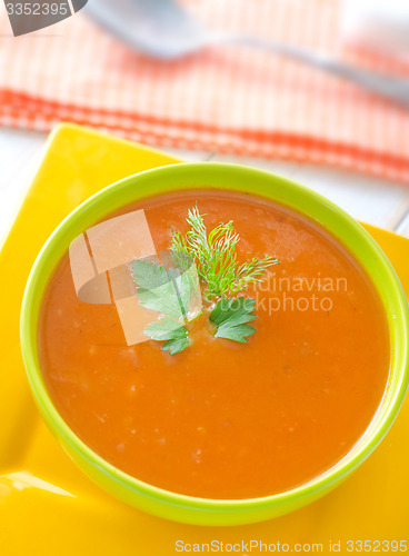 Image of Fresh soup from pumpkin in the green bowl