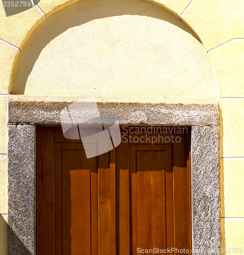 Image of cairate abstract     a  door curch  closed wood italy  lombardy 