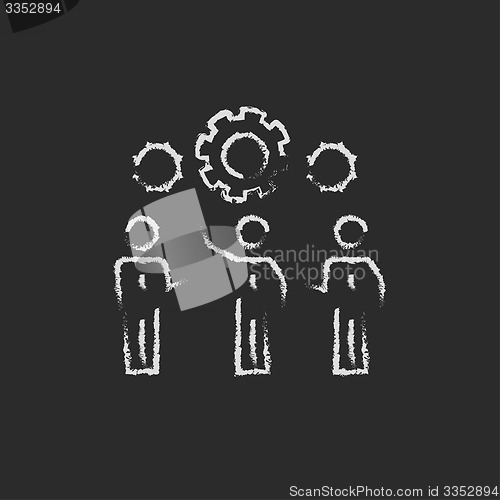 Image of Businessmen holding a gear of machine drawn in chalk