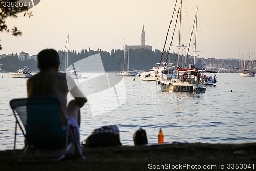 Image of Man sitting in chair on Adriatic coast