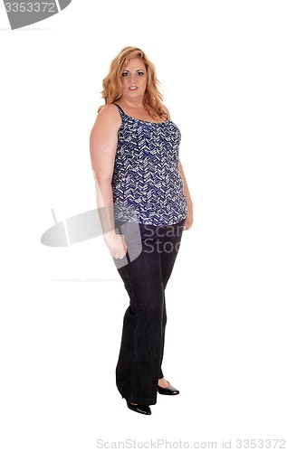 Image of Plus size woman standing in jeans.